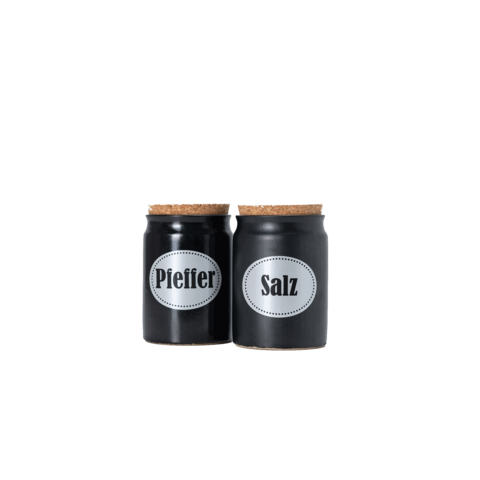 Zwei schwarze Gewürzgläser mit Korkdeckeln, beschriftet mit "Pfeffer" und "Salz".